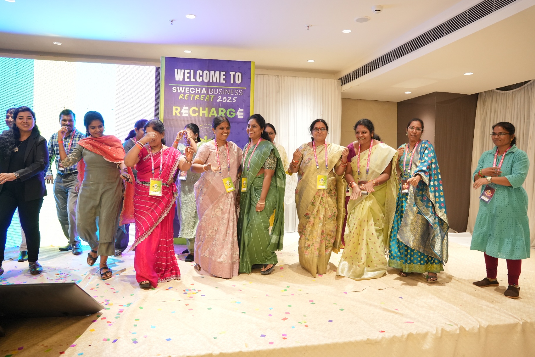 Women entrepreneurs celebrating on stage
